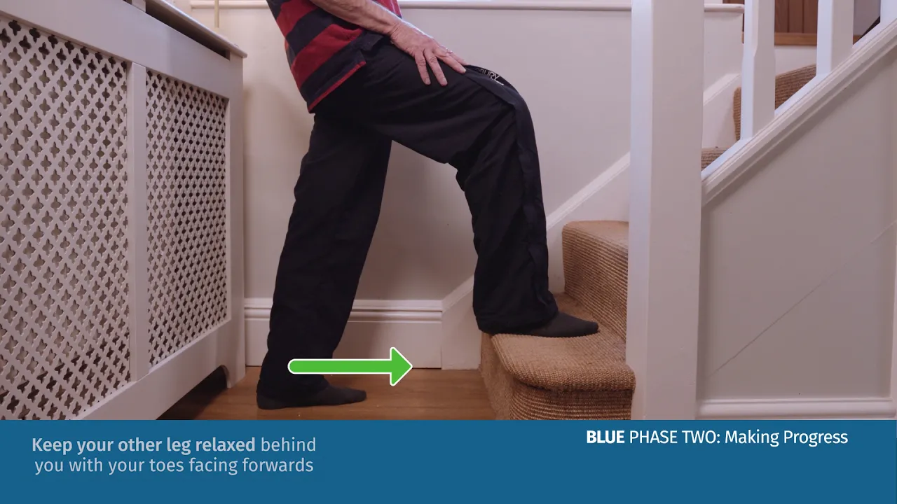 a person standing on a stool